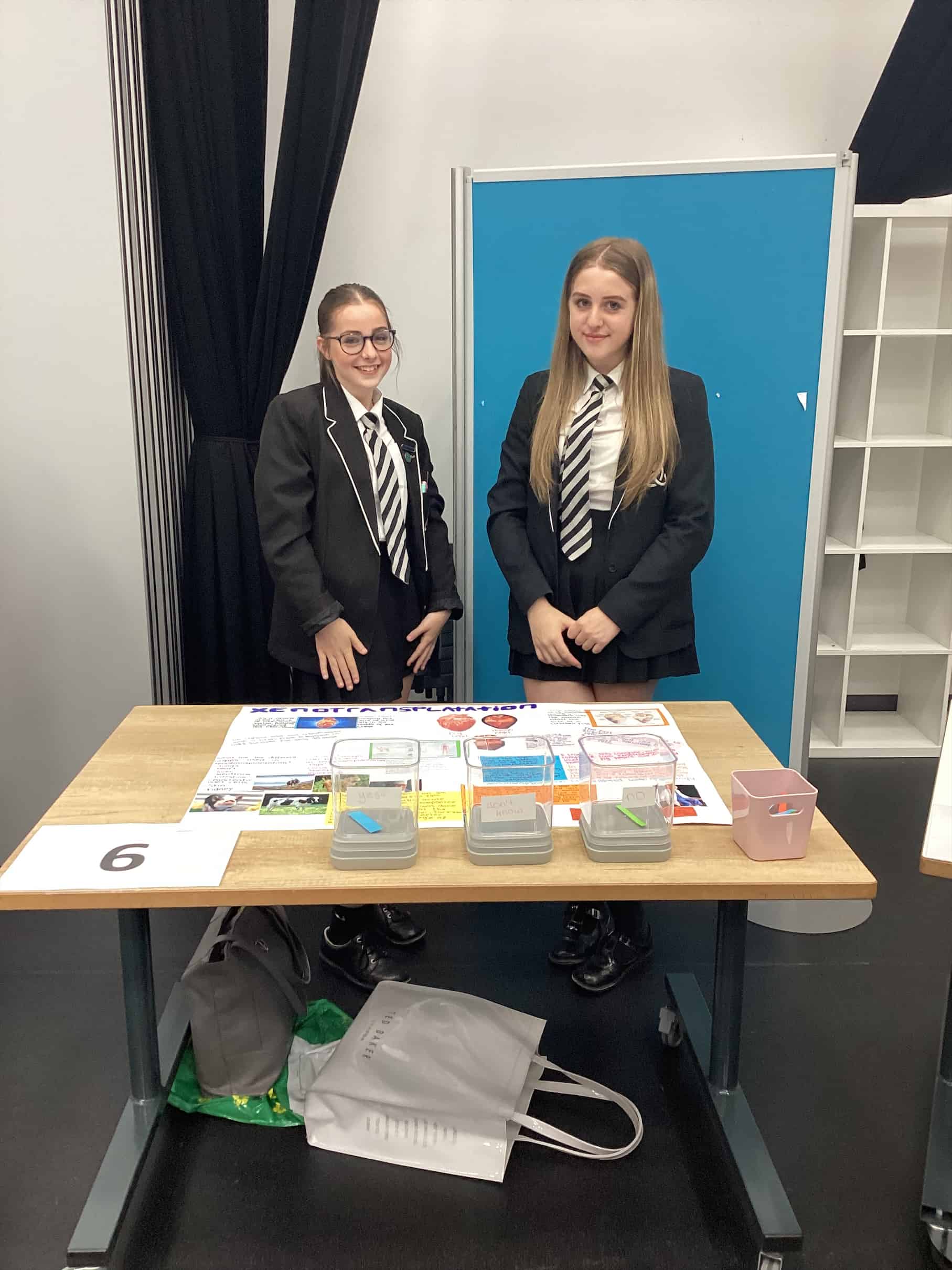 A team representing Laurus Ryecroft at the Trust Science Fair with their project on Xenotransplantation, during Super Science Week.