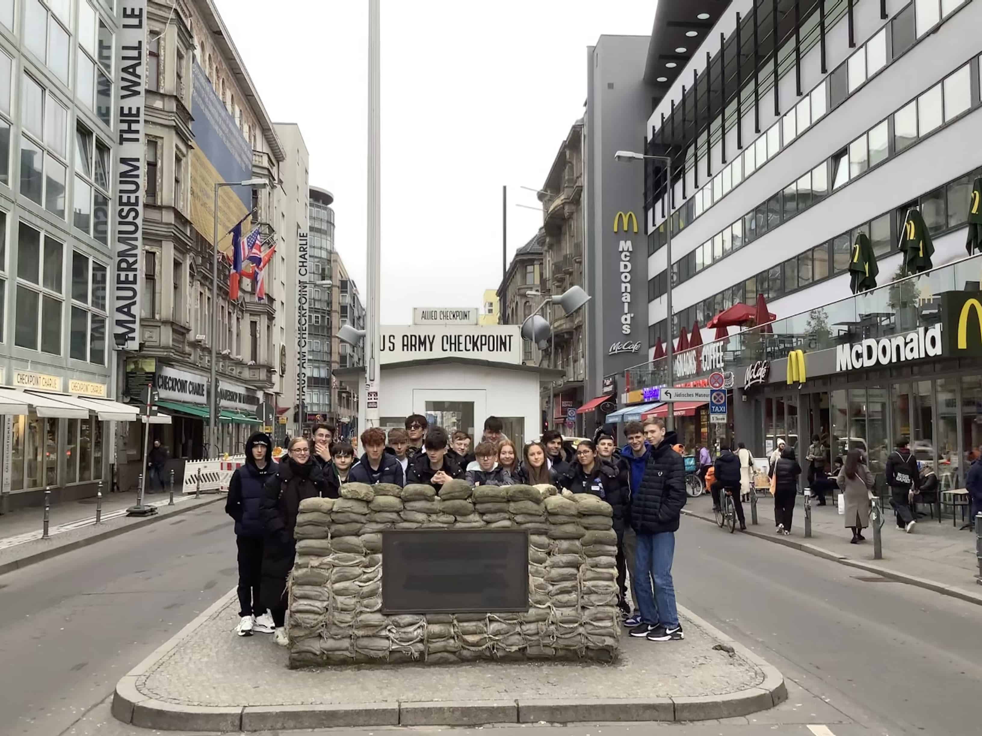 Students from Laurus Ryecroft stand at Checkpoint Charlie.