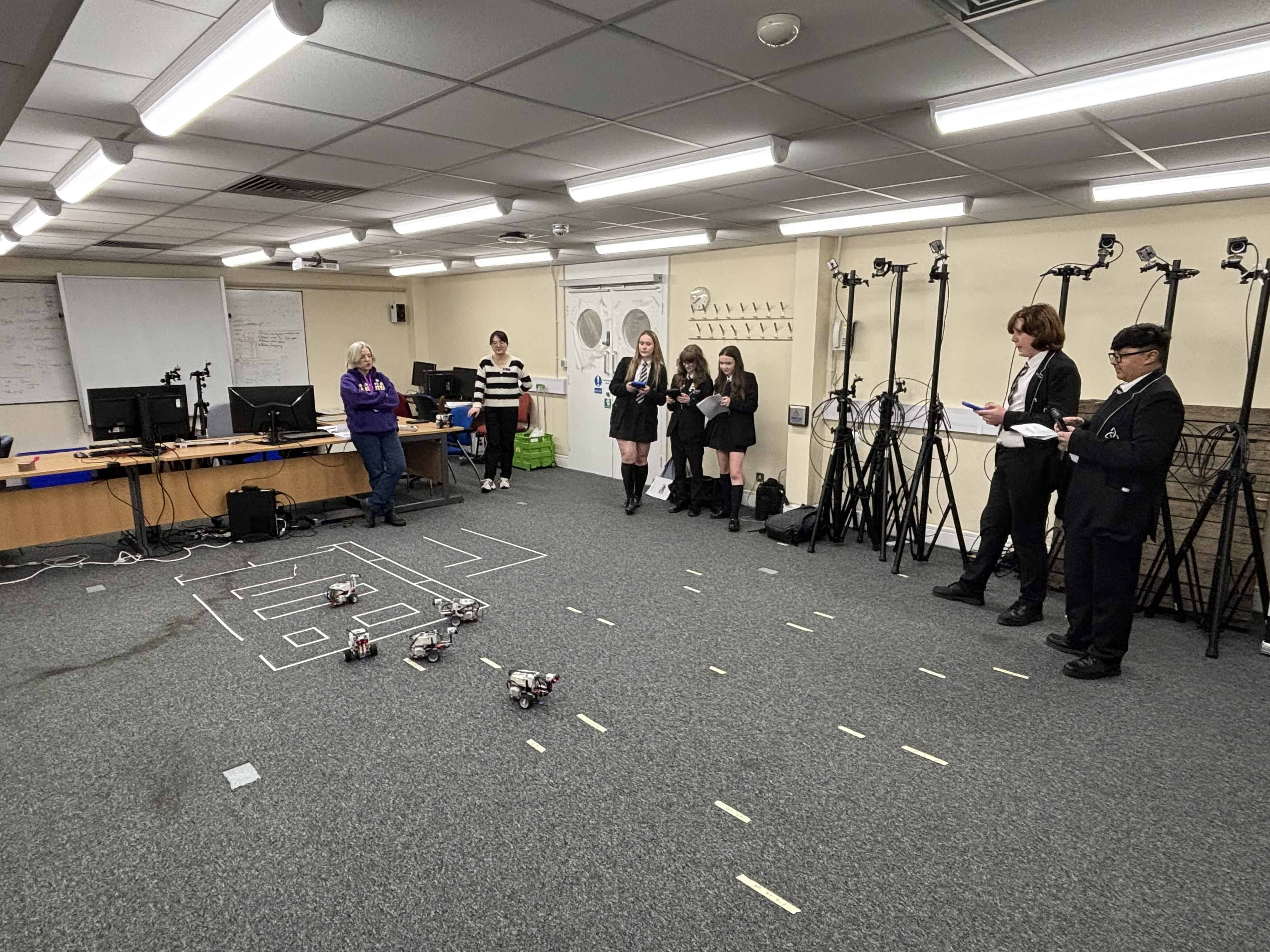 Students from Laurus Ryecroft control Lego Rovers at the University of Manchester Computer Science department.