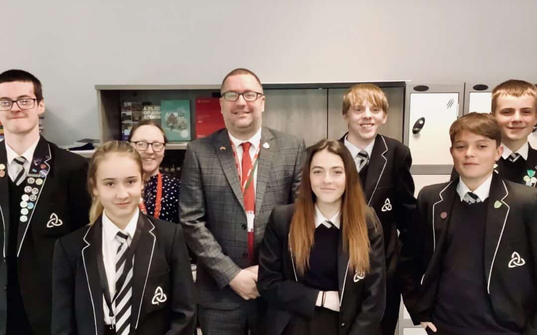 6 Laurus Ryecroft students and a teacher stand and smile with local Councillor David Mills