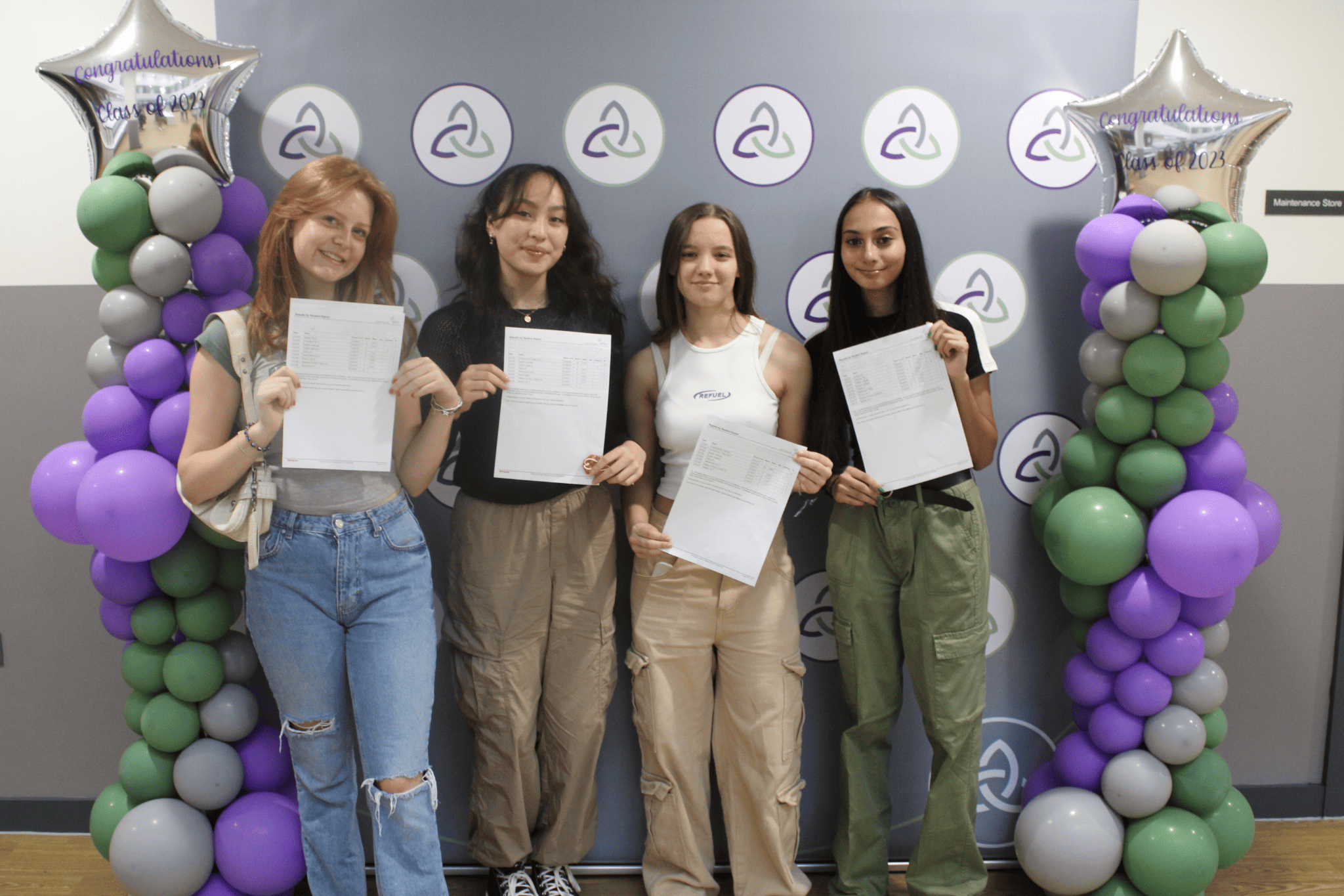 Four GCSE students from Laurus Ryecroft hold their GCSE results up.