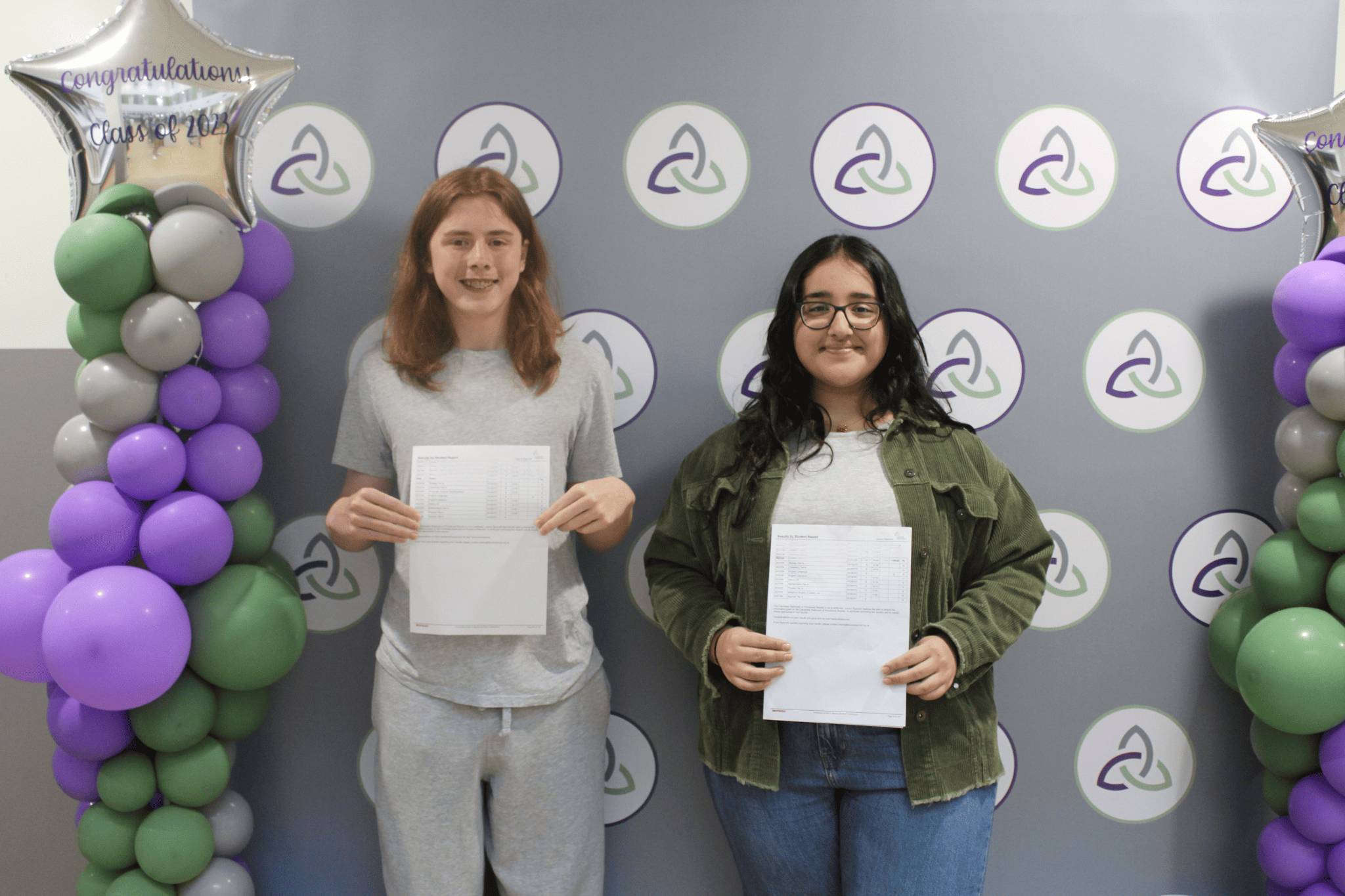 Two Laurus Ryecroft students hold their GCSE results smiling