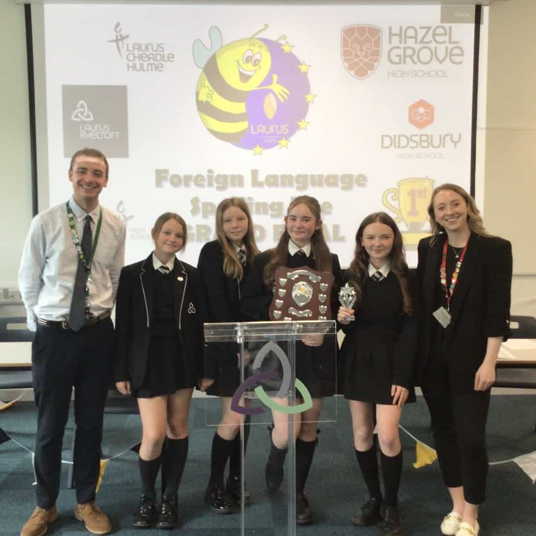 Laurus Ryecroft students at the Trust Spelling Bee final, holding their trophy.
