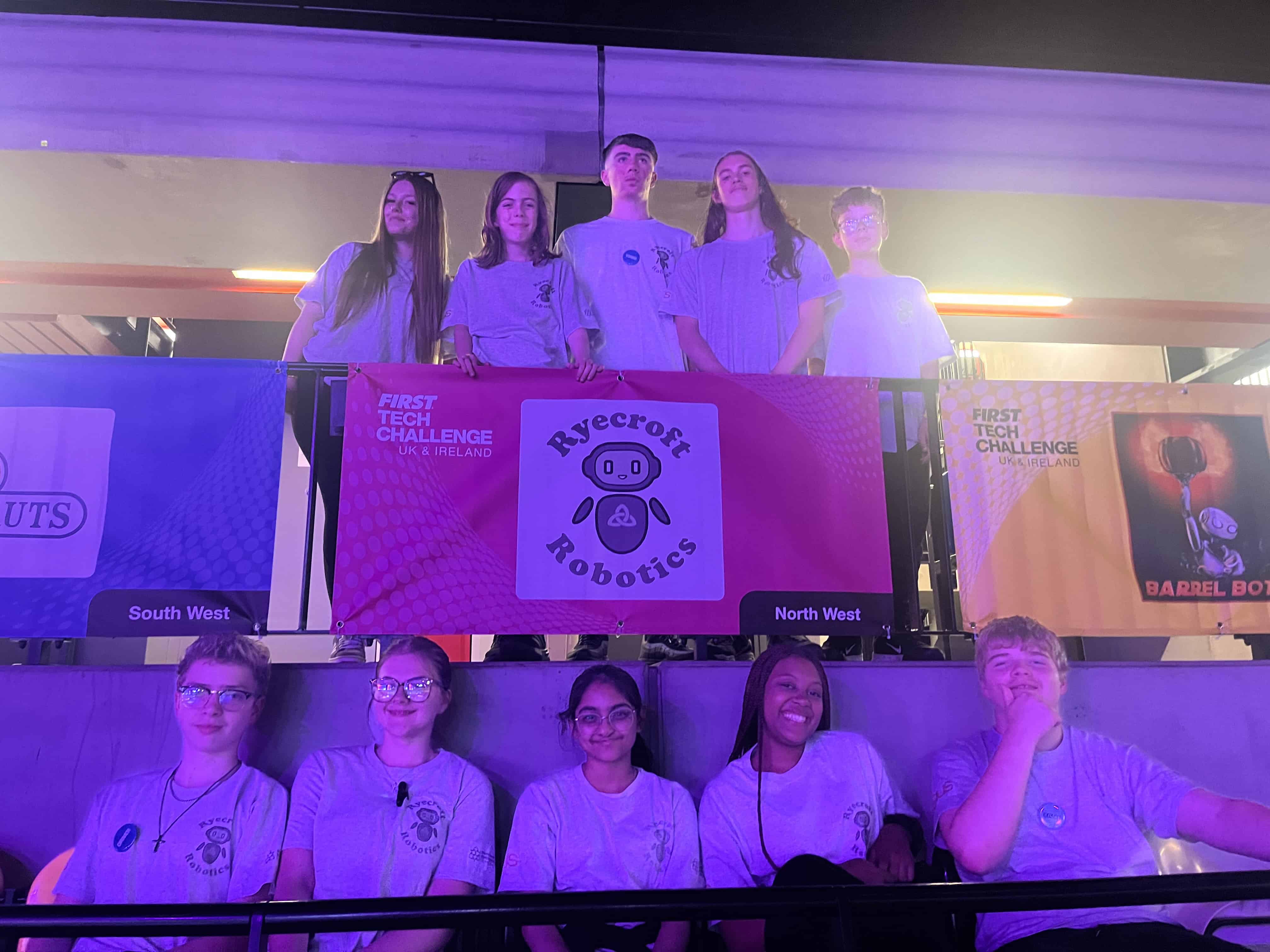 Laurus Ryecroft students hold their Ryecroft Robotics team banner as they attend the First Tech Challenge UK National Championships at London’s Copper Box Arena